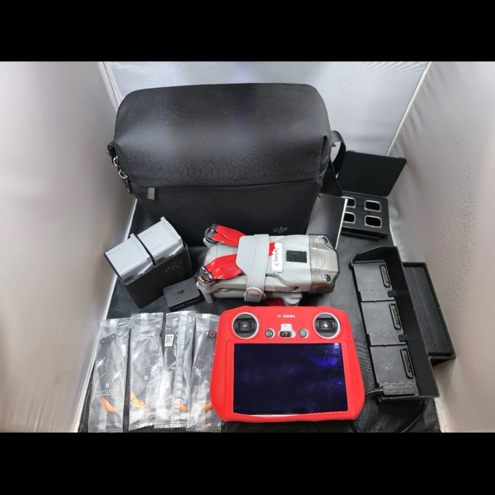 DJI Drone with Vibrant Red Controller and Accessories